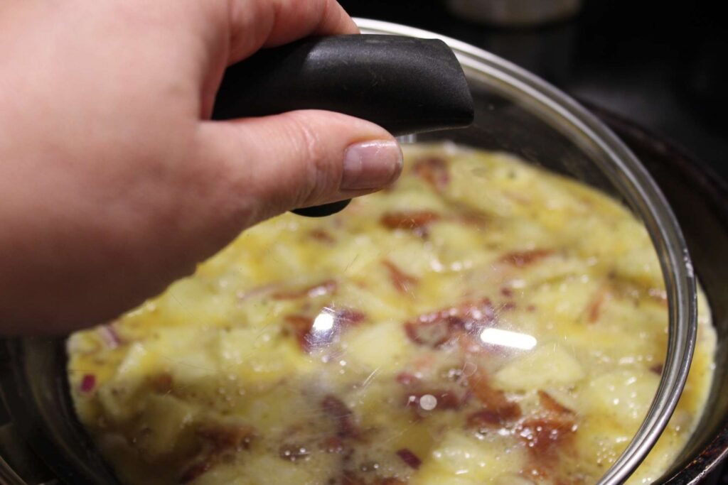 place a lid on the Spanish omelet variation recipe