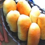 Quick hot dog buns lay on a basquek